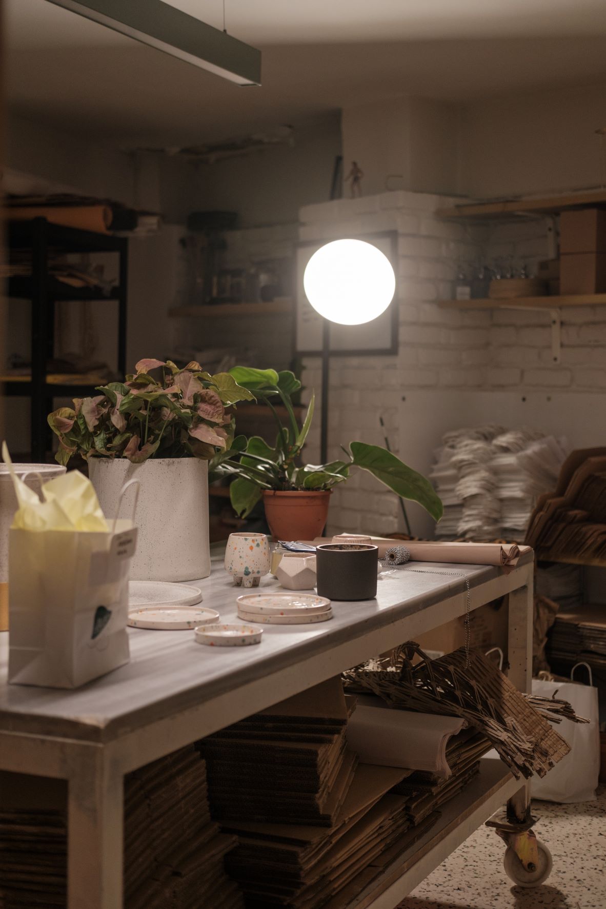 Basement desk with flowers and lamp