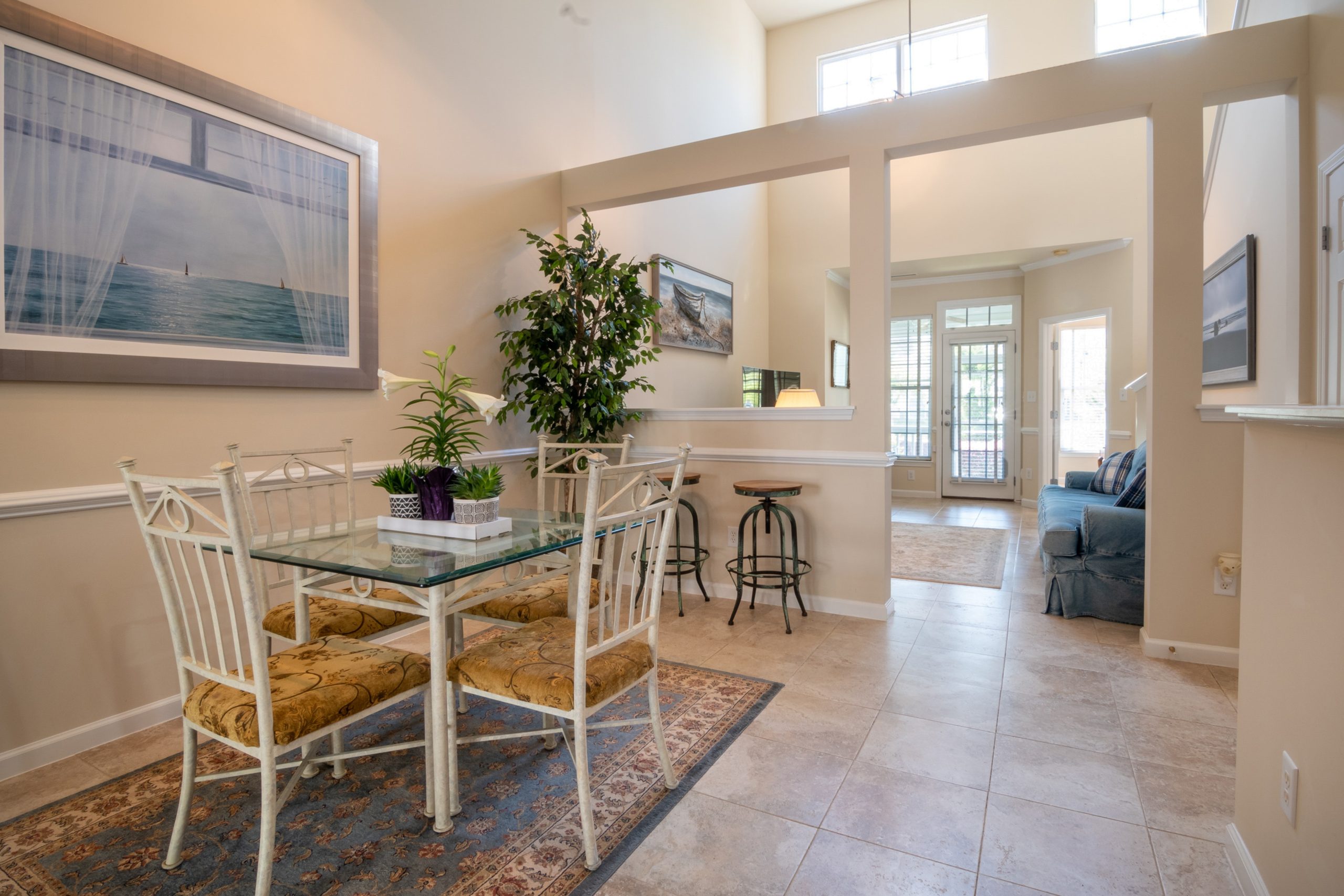 A dining area with a small table and chairs