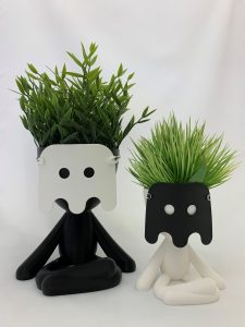 There are two Big Bob planter pots wearing masks.