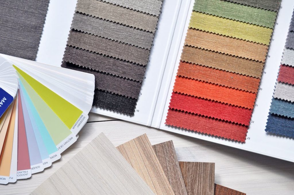Paint, fabric and veneer swatches spreading out.