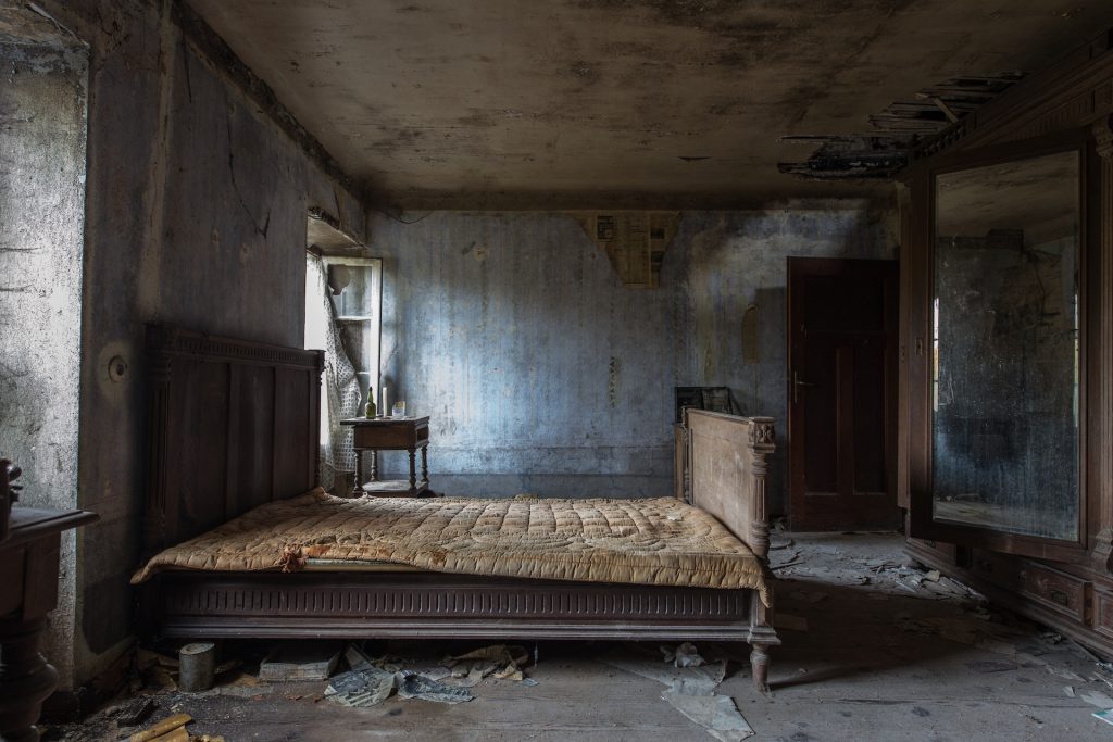A dirty, abandoned room with a filthy bed Off Cleaning Too Long