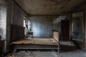 A dirty, abandoned room with a filthy bed Off Cleaning Too Long
