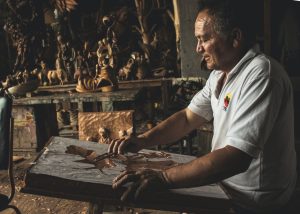 man carving wood four advantages of woodworking