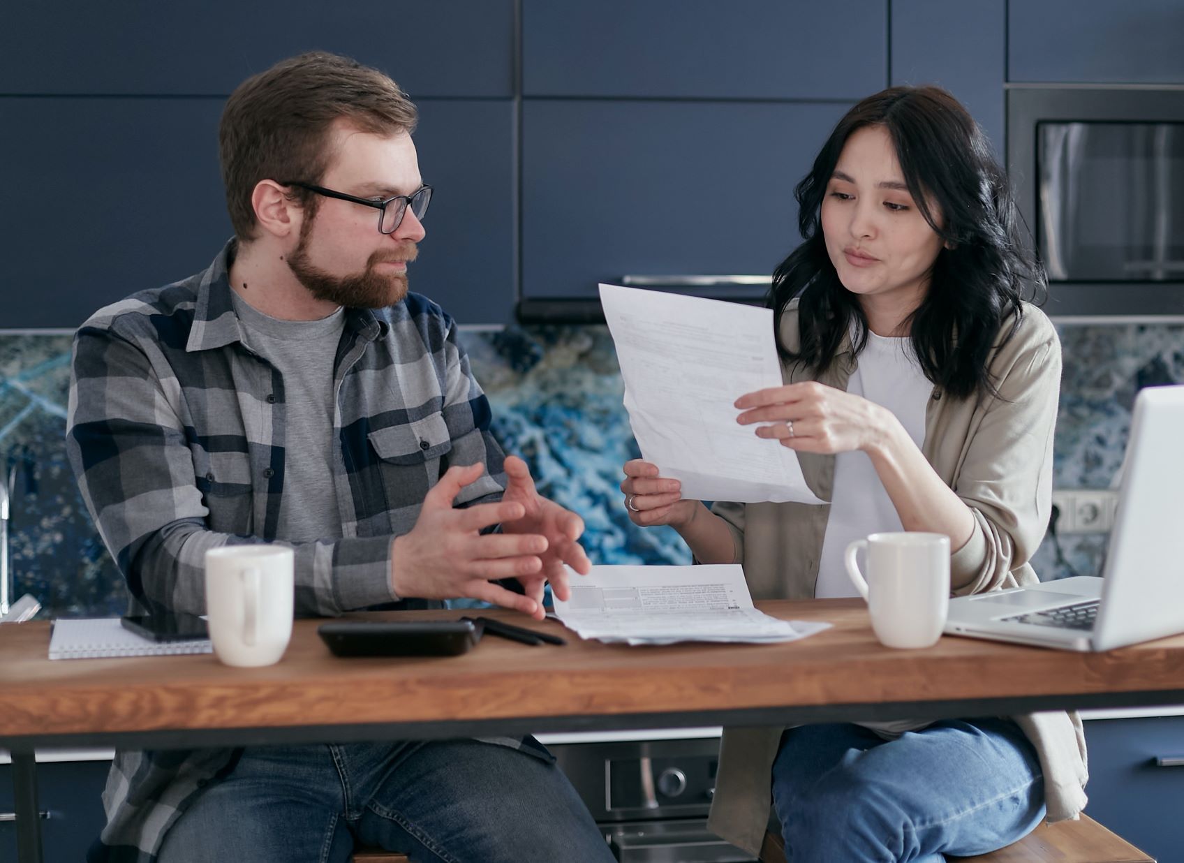 On Board With Paying Off Debt couple discussing debt
