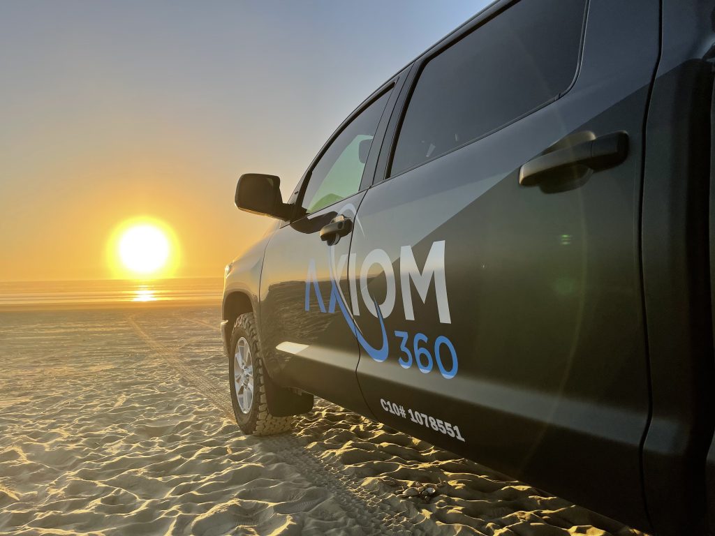 Axiom 360 logo on the truck promoting responsible solar energy services.