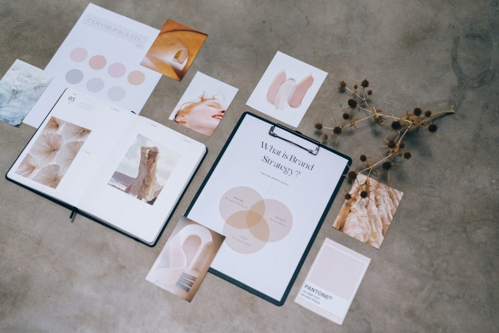 Marketing collaterals laid on a concrete surface.