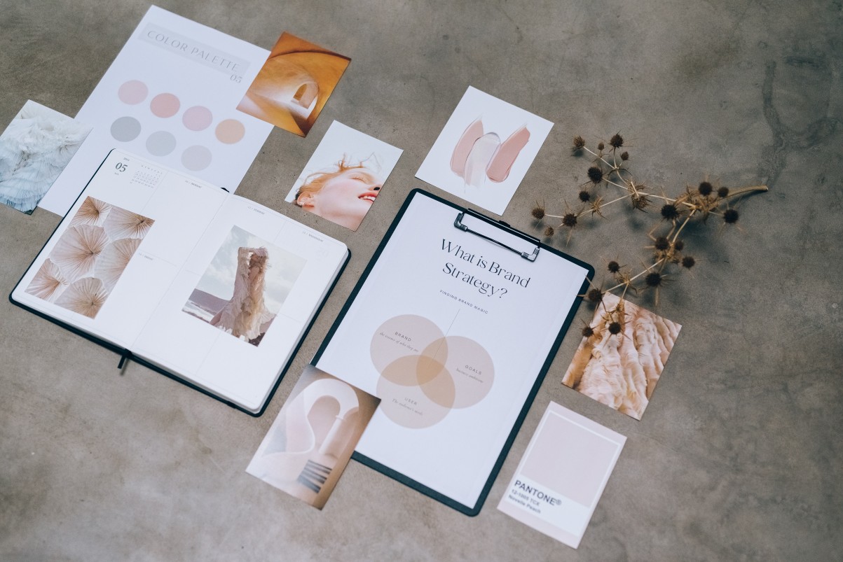 Marketing collaterals laid on a concrete surface.