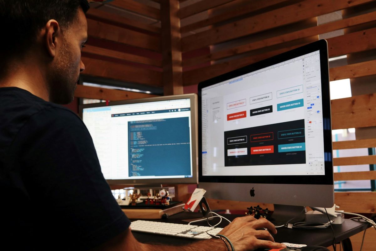 man web designing on computer choosing the right web design solution