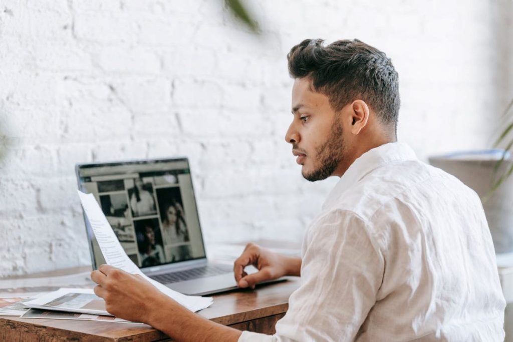 man reading paper learning how lead generation helps with content