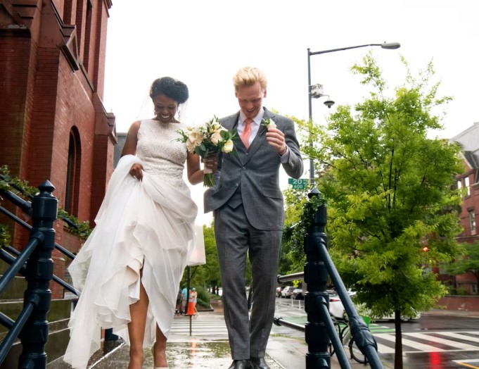Photo from Jac&Mac Photography | A married couple walking down the stairs.